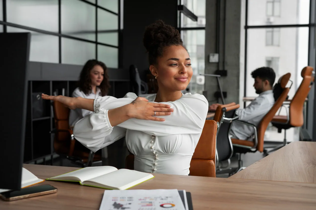 medium shot woman stretching work