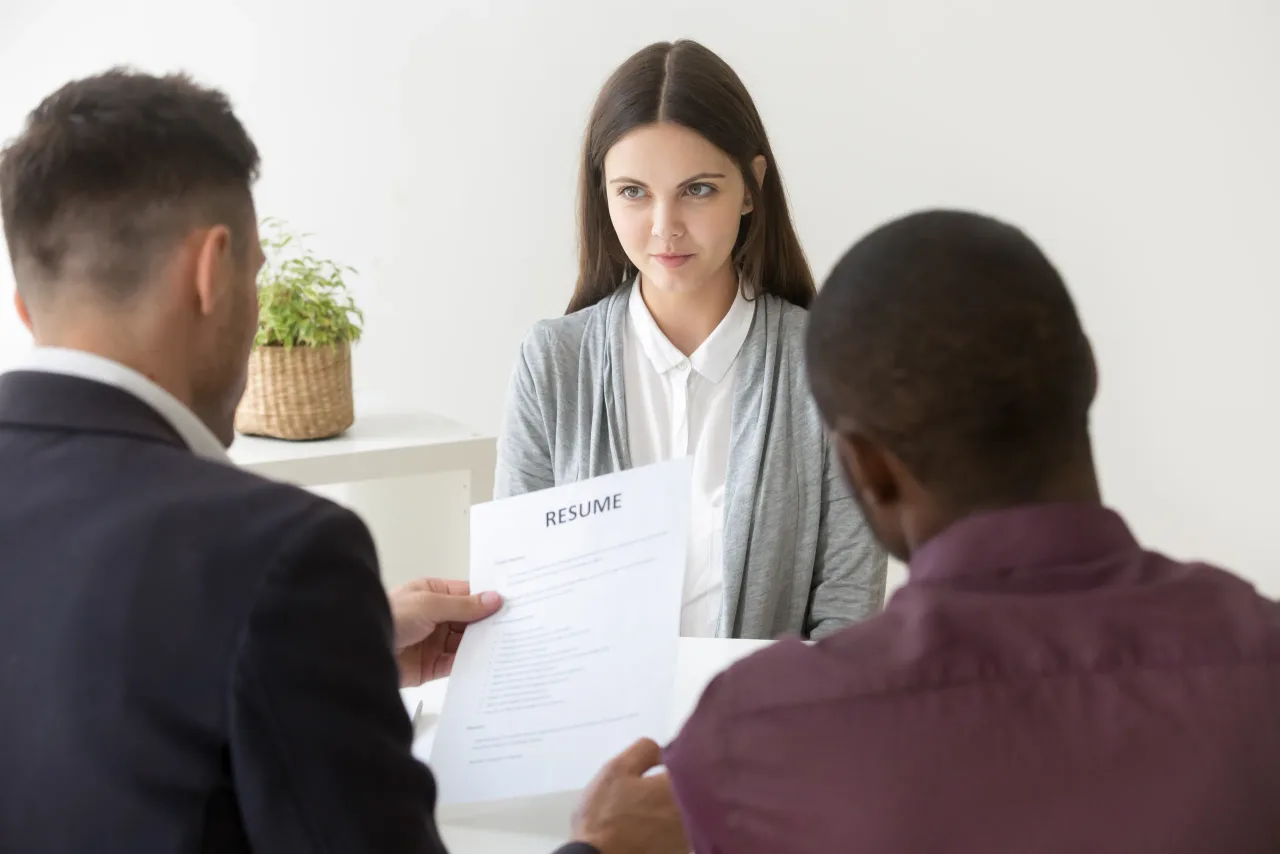 multiracial hr reading resume millennial job applicant interview