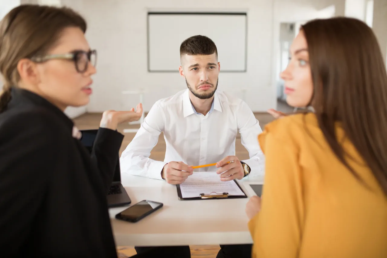young upset man white shirt sadly looking employers while spending time modern office male applicant waiting results job interview