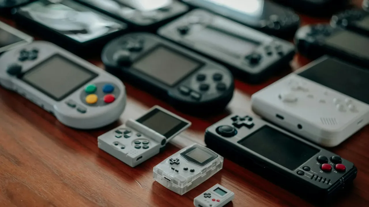Handheld gaming consoles showcasing Cross-Platform Gaming across multiple devices.