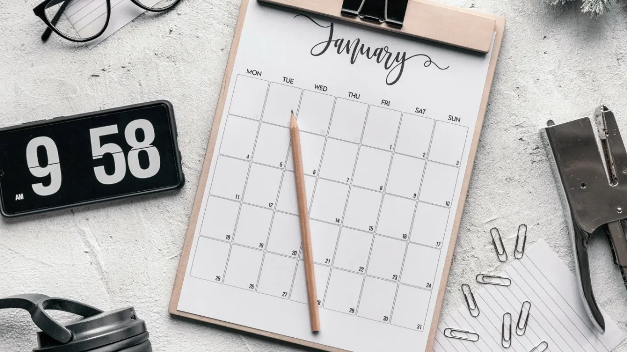 January calendar and clock on a desk, representing a Publisher Roadmap for planning key milestones and upcoming releases.