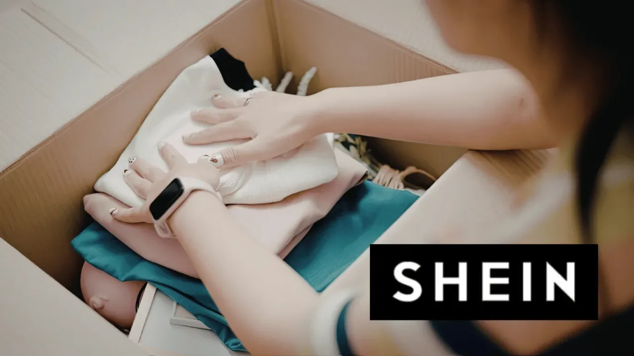 Unboxing free clothing items received through the Shein Free Trial program