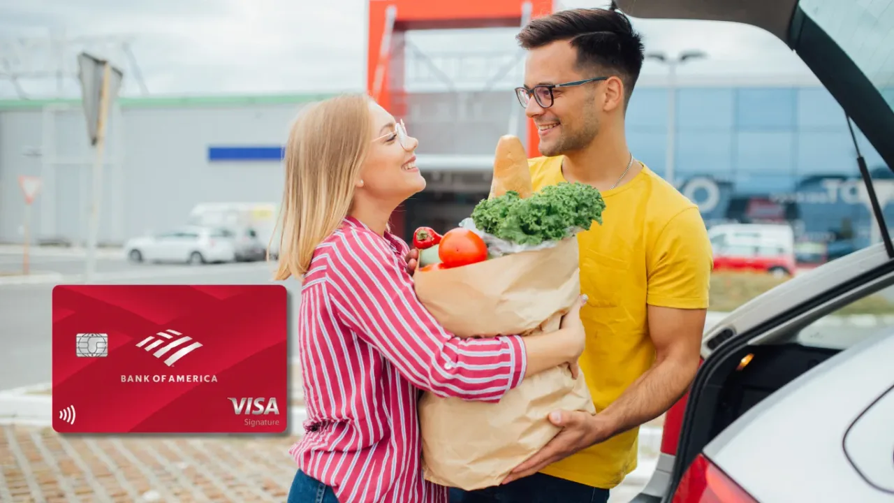 Bank of America Customized Cash Rewards credit card beside a smiling couple loading a grocery bag with bread, lettuce, and tomatoes into their car trunk.