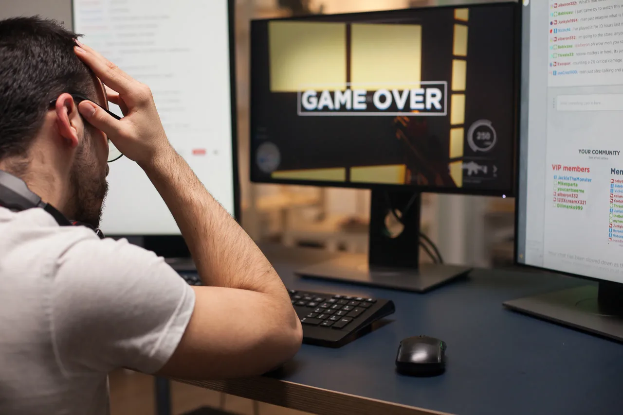 angry man with eyeglasses after hir loss online shooter game game competitive man