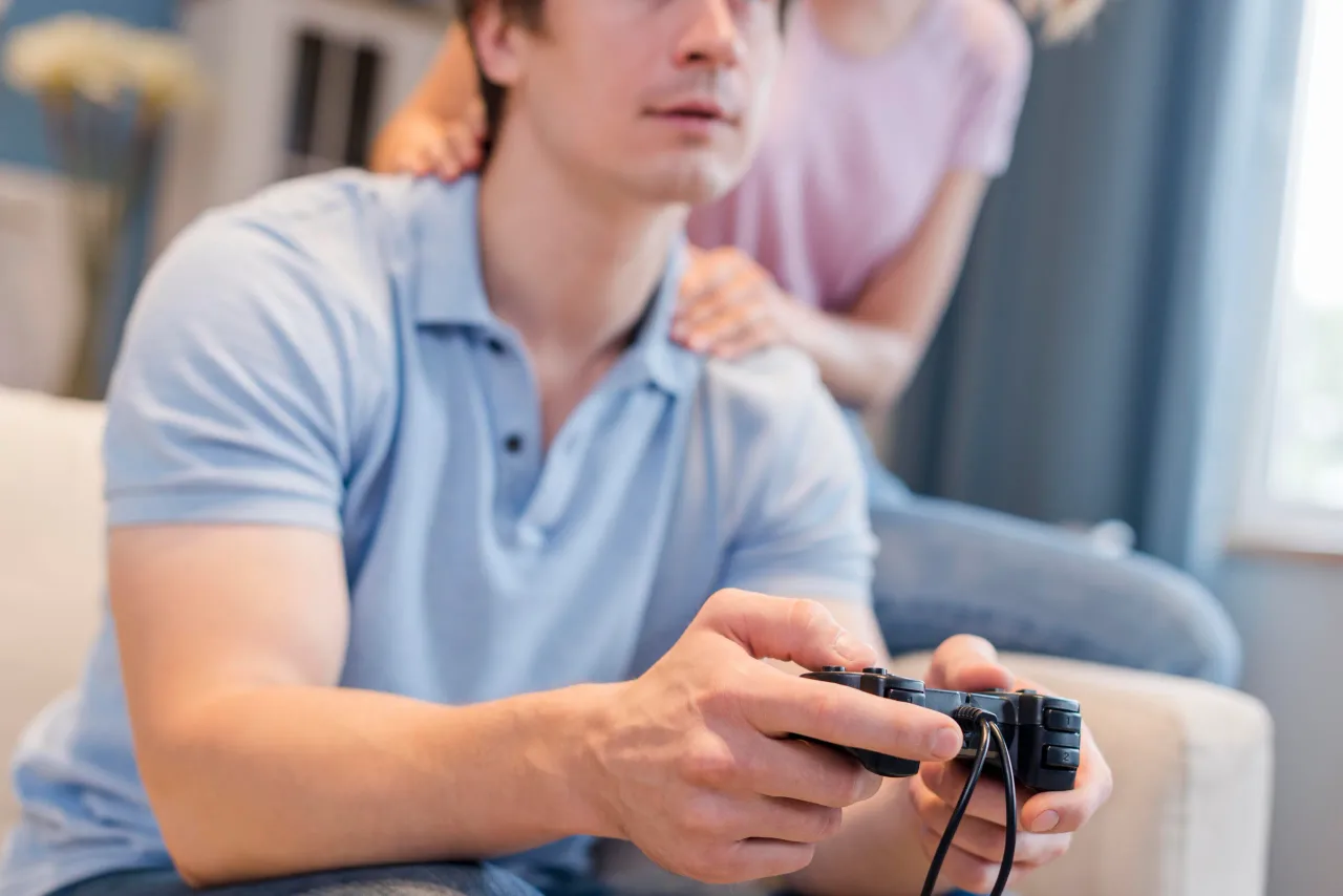 close up father playing video games