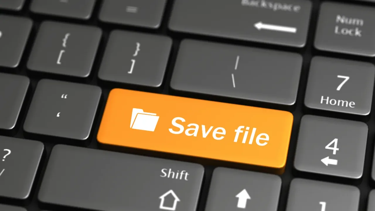A close-up of a keyboard key labeled "Save file," reminding gamers to implement Backup Strategies That Protect Game Save Files against data loss.